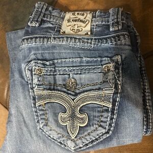 Rock Revival Light Blue Bootcut Jeans with Fleur-de-Lis Stitching